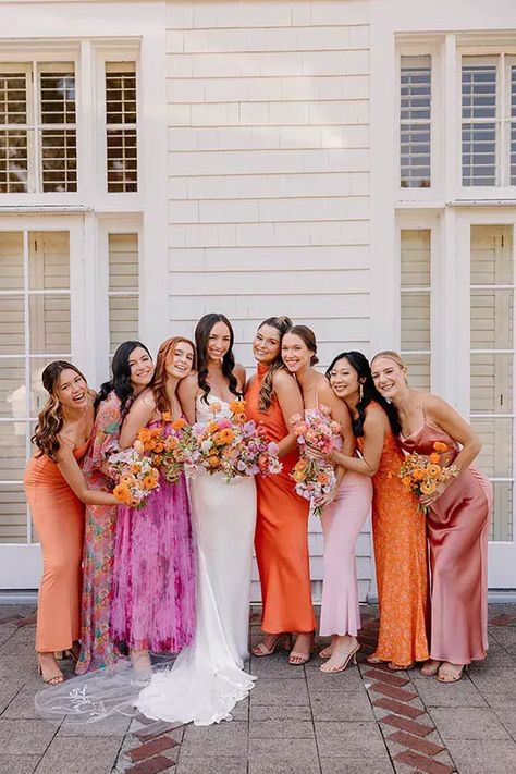 bride with bridesmaids in mix matched brightly colored dresses Neutral Wedding Party With Bright Flowers, Bright Boho Bridesmaid Dresses, Bright Mixed Bridesmaid Dresses, Bridesmaid Dresses Mismatched Colorful, Bridesmaid Dresses Not Matching, Mix Match Purple Bridesmaid Dresses, Mix Color Bridesmaid Dresses, Bright Wedding Bridesmaid Dresses, Fusia Dress Bridesmaid