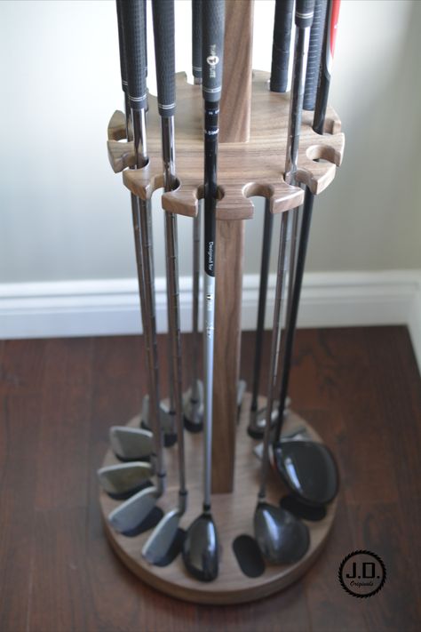 Golf club rack, golf club display, golf club holder, golf club storage, wood rack, wood holder This golf club holder is a spinning carousel design. It is constructed from solid Walnut and serves as a unique way to both store and display your golf clubs. This carousel accommodates up to 14 golf clubs (note: drivers and other large-head clubs may occupy two positions of the holder). Golf Club Display, Golf Club Storage, Golf Club Crafts, Golf Man Cave, Indoor Golf Simulator, Golf Crafts, Golf Simulator Room, Golf Stick, Carousel Design