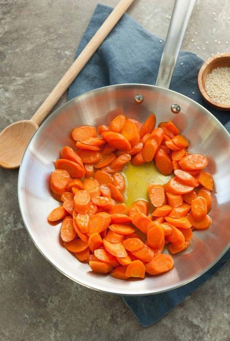 Glazed Ginger Carrots (Paleo, Vegan) | Maple syrup and fresh ginger create a sweet-hot glaze for carrots. Glaze For Carrots, Ginger Glazed Carrots, In A Bowl Recipes, Meals In A Bowl, Ginger Carrots, Paleo Side Dishes, Stove Top Recipes, Sides Recipes, Cooked Carrots