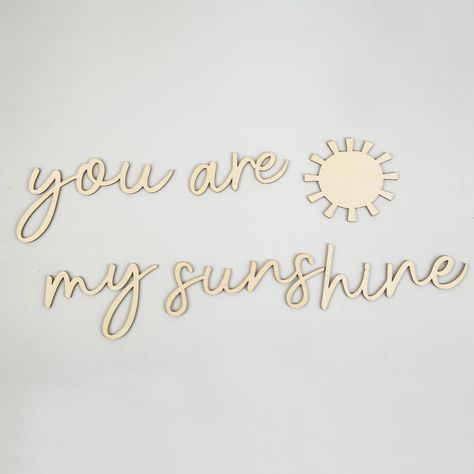 PRICES MAY VARY. WHIMSICAL WOODEN SCRIPT ART - The "You are My Sunshine" Wall Decor is a whimsical and enchanting piece of art perfect for nurseries, kids' rooms, and baby bedrooms. Crafted from wood, it features a beautiful script font that adds a touch of charm and warmth to any space. PERFECT FOR NURSERY AND CHILDREN'S ROOMS - This wall decor is designed to create a joyful and uplifting atmosphere in nurseries and children's rooms. The message "You are My Sunshine" brings a sense of love and You Are My Sunshine Nursery Ideas, You Are My Sunshine Wallpaper, Sun Themed Nursery, Sun Decal, Wood Sun, Sunshine Wallpaper, Wall Stickers For Kids, Art For Nursery, Baby Room Themes