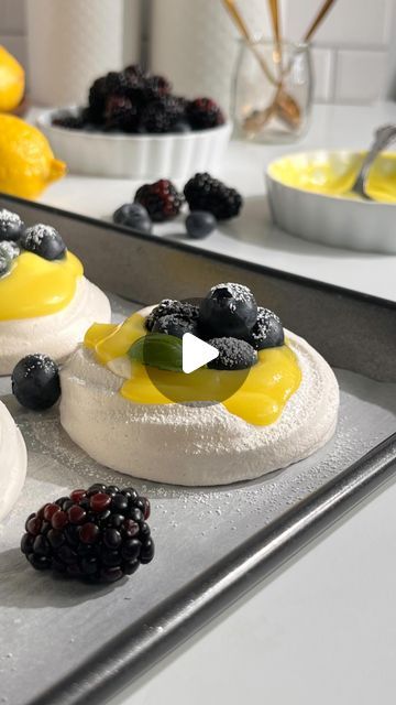 Saloni Mehta | Vegan & Eggless Baking on Instagram: "Pavlova with Lemon Curd and Blueberries 

Pavlova is basically a cross between a meringue and marshmallow. It has a crisp and crunchy crust on the outside and soft- gooey on the inside. Topped with a tangy eggless lemon curd and fresh berries! This dessert is gluten free, vegan, eggless and dairy free. It is so simple and fun to make. Recipe 👇👇

Get all the bakeware for this recipe from @bakerssecret_official 

Pavlova Recipe:
Yield: 10-12 pavlova 

•180ml (3/4 cup) Aquafaba ( brine from 2 cans of chickpeas, 350ml reduced to 180ml)
•1/4tsp Xanthan gum 
•1/4tsp Cream of tartar
•pinch of Salt 
•200g (1 cup)  Granulated Sugar
•1 tablespoon Corn Starch 
•2 teaspoons Vanilla Extract 

Method:
-Preheat oven to 230f. Prepare a large baking tr Eggless Lemon Curd, Pavlova With Lemon Curd, Meringue Pavlova, Pavlova Recipe, Eggless Baking, Baking Tray, Cream Of Tartar, Stand Mixer, Fresh Berries