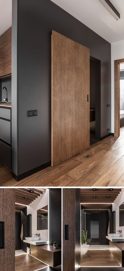 A sliding wood door defines this modern bathroom, while hidden lighting has been used in the floor, creating a soft glow and lighting up the mostly dark room. The white tiles help to reflect the light throughout the space. Utility Sliding Doors, Hidden Toilet Door, Grey And Brown Kitchen, Doors Colors, Masculine Apartment, Apartemen Studio, Sliding Wood Doors, Hidden Lighting, Desain Pantry