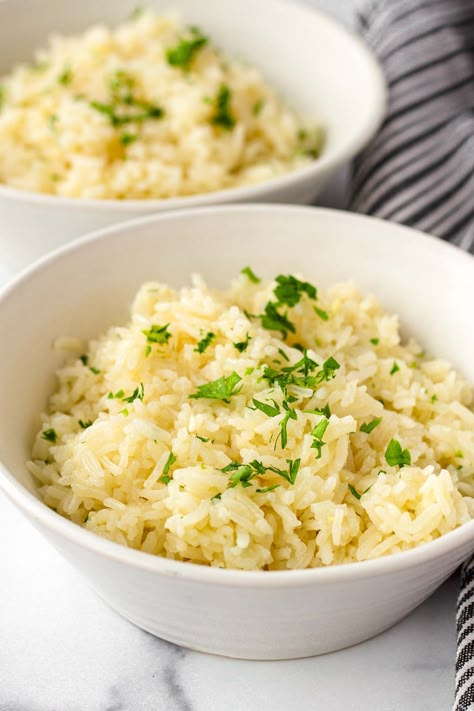 Garlic Butter Rice! This easy garlic butter rice is soft, fluffy, and tender. The flavors are garlicky and buttery, and it pairs so well with so many main dishes to complete a meal. Try this garlic butter rice! Garlic White Rice, Garlic Butter Rice In Rice Cooker, Garlic Rice In Rice Cooker, Herbed Rice Recipes, Garlic Butter Rice Recipes, Herb And Butter Rice, Brown Butter Rice, Garlic Butter Rice, Herbed Rice