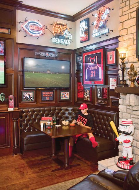 The homeowner's son enjoys an after-school snack in the corner booth of their sports bar living room. Photo by Robin Victor Goetz / www.GoRVGP.com Sport Bar Design, Sports Man Cave, Sports Pub, Bar Deco, Ultimate Man Cave, Man Cave Room, Man Cave Basement, Cave Home, Man Cave Home Bar