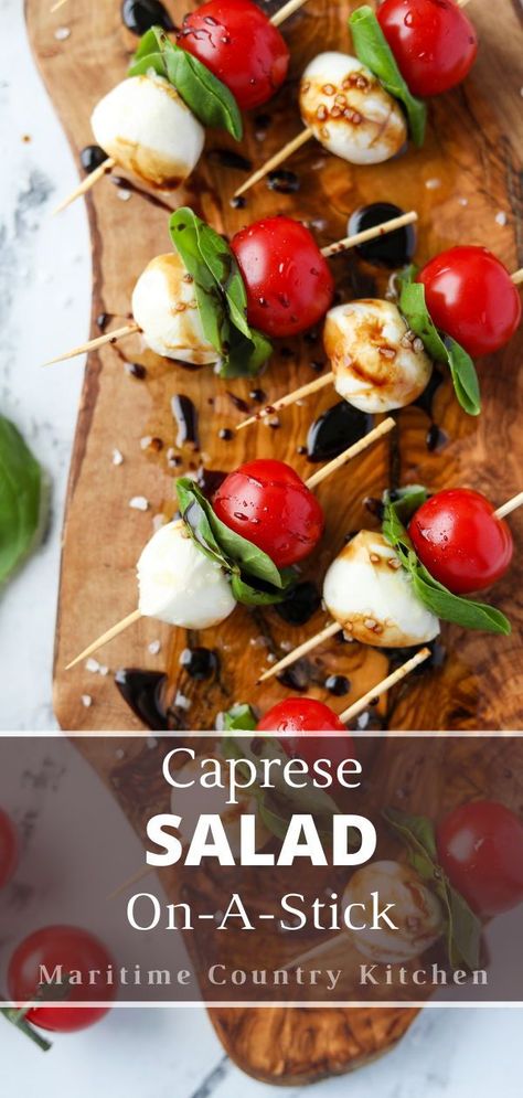 This easy recipe for Caprese skewers features all of the flavor of Caprese salad - but on a stick!Featuring juicy cherry tomatoes, creamy mozzarella balls, and aromatic basil, this fun appetizer is both fancy and flavorful. Caprice Salad Tomato Mozzarella Caprese Skewers, Charcuterie Board Caprese, Mozerella Tomato Skewers, Classy Wedding Appetizers, Caprese On A Stick, Tomato Basil And Mozzarella Appetizers, Recipes With Fresh Mozzarella Balls, Cherry Tomatoes Appetizers, Cherry Tomatoes And Mozzarella Balls