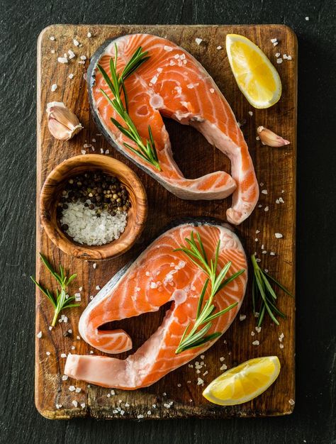 Salmon steaks result from making vertical cuts all the way through the fish, as opposed to removing the fillets and trimming them down to single portions. This cut of fish... Leaping Salmon, Fish Food, Salmon Fish Photography, Raw Salmon Aesthetic, Salmon Photo, Salmon Images, Fish Food Photography, Wild Salmon Recipe, Salmon Steak Recipes