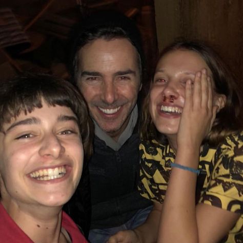 Image may contain: 3 people, people smiling, night Will Byers Season 3, Millie Bobby Brown Noah Schnapp, Shawn Levy, Eye Symbolism, Hand Signs, Stranger Things Quote, Stranger Things Season 3, Stranger Things Kids, Stranger Things Actors