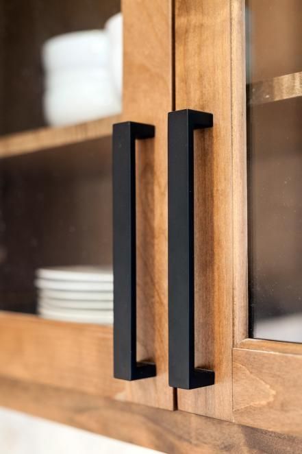 Update your cabinets with matte black hardware Wood Cabinets With Black Handles, Modern Drawer Pulls Black, Black Kitchen Drawer Handles, Black Drawer Pulls On Wood Cabinets, Black Door Handles Kitchen, Modern Black Drawer Pulls, Contemporary Kitchen Cabinet Hardware, Black Cabinet Door Handles, Kitchen Door Handles Black