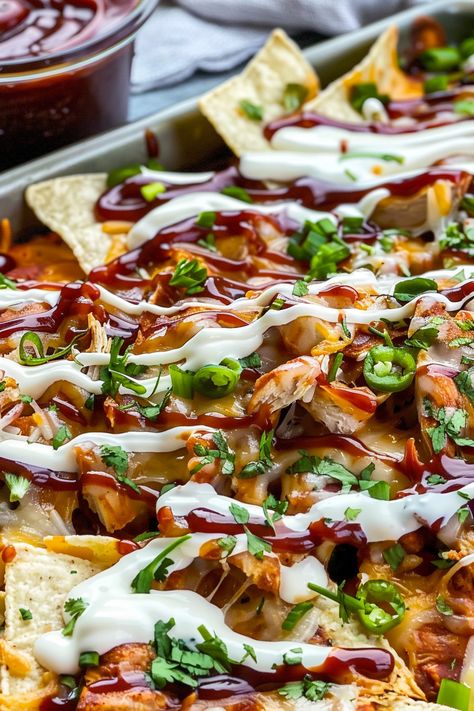 Easy Sheet Pan BBQ Chicken Nachos: Tangy BBQ chicken, melty cheese, and crispy chips. Ready in 20 minutes, perfect for any gathering! Sheet Pan Bbq Chicken, Pan Bbq Chicken, Bbq Nachos, Bbq Chicken Nachos, Baked Nachos, Chicken Nachos Recipe, Nachos Recipe Easy, Chicken And Chips, Crispy Chips