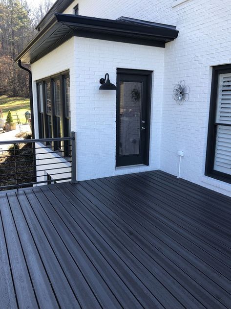 Black Deck Ideas Outdoor Living, Modern Farmhouse Railing Exterior, Black Back Deck, Painted Composite Decking, Dark Composite Decking, Modern Composite Deck, Black Deck White House, Black Trex Deck, White House With Black Deck