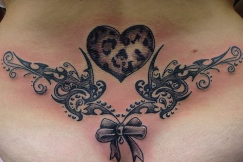 LOVE THIS... heart... leopard print...tribal...bow.. lower back tattoo design <3 Big Tramp Stamp, Belly Button Tattoos For Women Cover Up, Tramp Stamp Bow Tattoos, Women’s Tramp Stamp Tattoos, Leopard Print Heart Tattoo, Leopard Print Back Tattoo, Leopard Print Bow Tattoo, Leopard Print Tattoo, Belly Button Tattoos