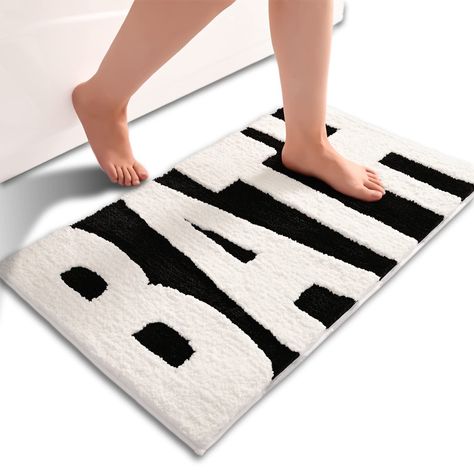 PRICES MAY VARY. ❤BATH 3D Design❤: The bathroom rug top is printed with the word "BATH", and looks atmospheric, simple, and fashionable, and the bath rugs designed for your bathroom, can well decorate your bathroom and make your bathroom more fashionable and eye-catching. ❤Non Slip TPR backing❤: Our non slip bathroom mat backing is made of durable TPR material with regular and beautiful texture, which has a better visual effect and stronger friction. Floor mat performance is far better than that Bathroom Mistakes, Black And White Bathroom Rug, Unique Bath Mats, Bathroom Finds, White Bathroom Rug, Amazon Bathroom, Vanity Modern, Vanity Black, Bathtub Mats