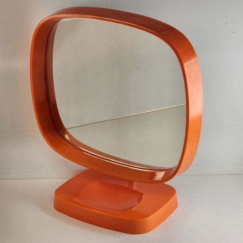 1960's Danish Mod Dresser Top Mirror, Groovy Man! 
Imagine a mirror that doesn’t just reflect your image but also the vibrant spirit of the '60s. 
This Mirror is yearning to bring its Flower Power Orange zest back into someone’s life. This isn’t just a piece of decor; it’s a portal to a groovy era, missing the gaze of someone who appreciates its uniqueness. 
This and other vanity mirrors can be found in our eBay store!🌼🧡 

 #Mirror #VanityMirror #MakeupMirror  #ArtDeco Orange Danish, Cake Makeover, 70s Mirror, Orange Stuff, 60s Decor, Mirror Dresser, Mid Century Mirror, Plastic Mirror, Dresser Vanity