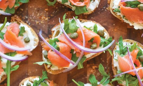 Re-imagine your favorite bagel and lox-a New York City classic-as cute bite-sized toasts topped with whipped feta, thinly sliced smoked salmon, arugula,... Lox Toast, Salmon Arugula, Lox Breakfast, Smoked Salmon Toast, Lox Recipe, Salmon Toast, Salmon Lox, Salmon Breakfast, Smoked Salmon Bagel