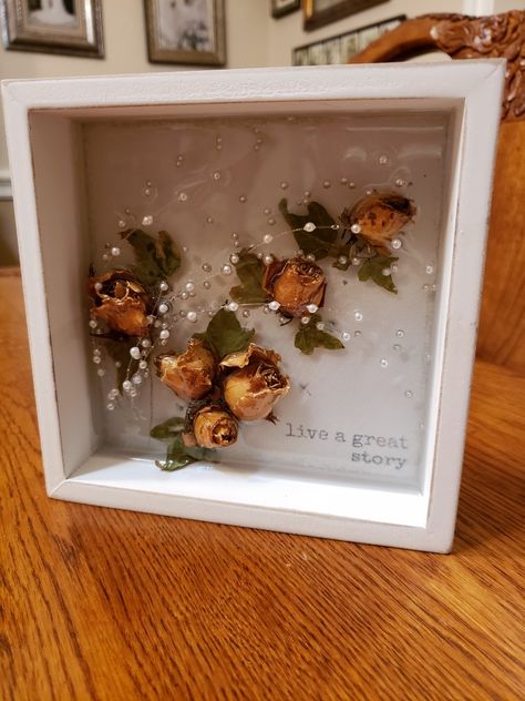 Found my dried wedding bouquet (33 years ago) and made this pretty layered resin wall art with flowers, leaves, and pearl strands. Dried Roses Gift Ideas, Dried Rose Resin Art, Dried Wedding Bouquet, Dried Flowers Crafts, Art With Flowers, Dried Roses, Flower Shadow, Drying Roses, Flower Shadow Box