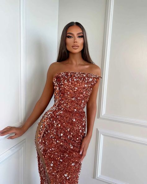 Share with a friend or tag a friend who would look exquisite in this gown! To order this mesmerizing copper gown, send us a DM at @reineecouture. This captivating copper gown is the epitome of haute couture, blending bold glamour with intricate detailing. The plunging halter neckline is framed by a cascade of shimmering embellishments, leading the eye down to the form-fitting silhouette that beautifully hugs your figure. The asymmetrical ruffled shoulder adds a striking, artistic element, ma... Coral Gown, Custom Made Dresses, Silver Gown, Sequin Evening Gowns, Exquisite Gowns, One Shoulder Gown, Embellished Gown, Stunning Gowns, Mermaid Silhouette