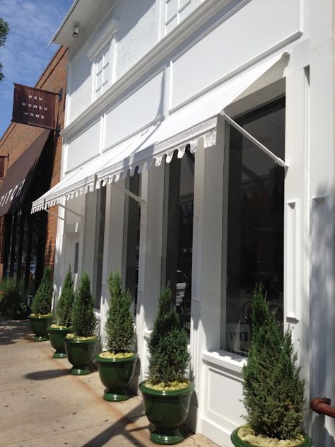 white awning + connifers. love the idea of incorporating plants into storefront design Shop Awning, Shop Facade, Storefront Design, Shop House Ideas, Shop House Plans, Shop Fronts, Shop Front Design, Shop Front, Shop Window Displays