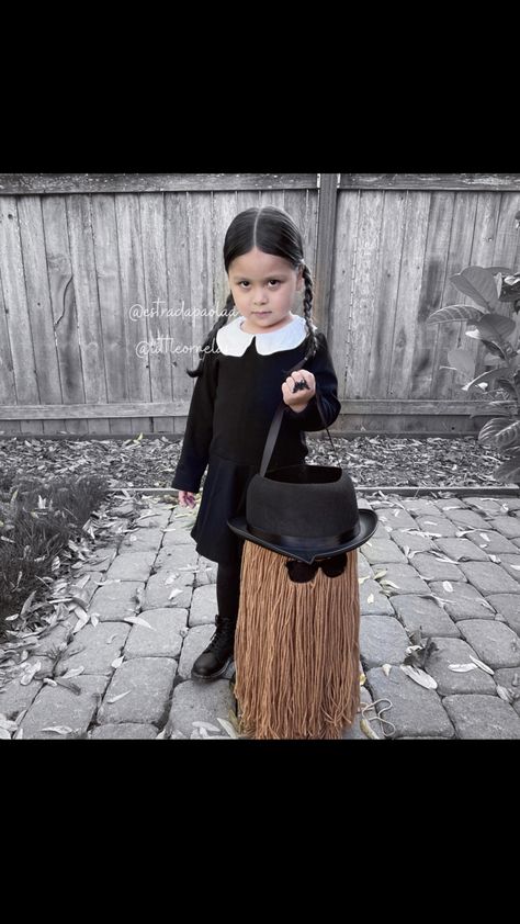 Halloween costume wednesday addams toddler cute spooky cousin it addams family diy Wednesday Addams And Cousin It, Adam's Family Costumes, Wednesday Addams Toddler Costume, Homemade Wednesday Addams Costume, Wednesday Toddler Costume, Baby Wednesday Addams Costume, Spooky Toddler Halloween Costume, Adams Family Costume Ideas, Toddler Wednesday Addams Costume