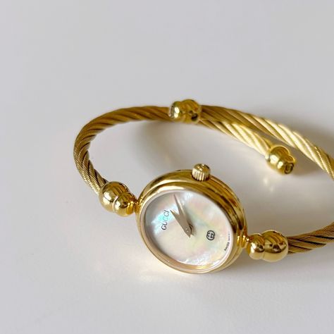 SOLD** Gucci seashell dial gold plated bangle watch from the 90s 90’s Jewelry, Dainty Watches, Jewellery Lookbook, Vintage Gold Jewellery, Dreamy Accessories, Vintage Gold Watch, Pretty Watches, Timeless Watches, Gold Plated Watch