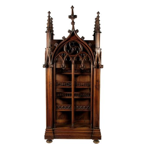 date unspecified A 19th century continental walnut Gothic cabinet Estimate: £4,000 - £6,000 + Buyers Premium A 19th century continental walnut Gothic cabinet, with carved and pierced decoration, with an open front and sides with four galleried shelves, 89½in (227.4cm) high, 38in (96.5cm) wide, 20in (50.8cm) deep. Gothic Revival Furniture, Gothic Home Interior, Miniature Theatre, Gothic Cabinet, Christmas Crib, Gothic Ideas, Medieval Furniture, Fantasy Furniture, Gothic Furniture