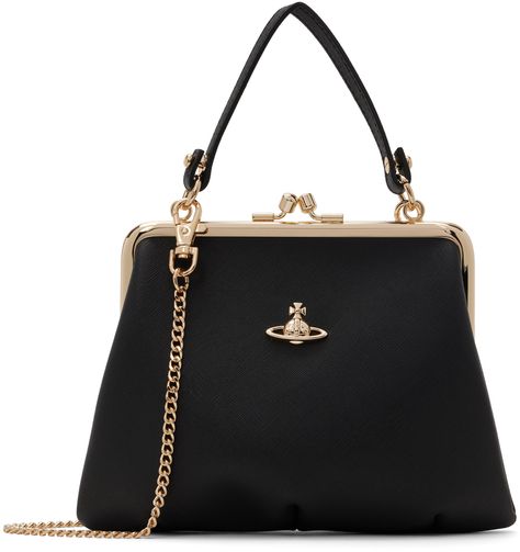 Saffiano faux-leather top handle bag in black. · Detachable carry handle · Detachable curb chain crossbody strap · Logo hardware at face · Kiss-lock closure · Zip pocket at interior · Twill lining · Gold-tone hardware · H6 x W7 x D2.5 Supplier color: Black Vivienne Westwood Purse, Vivienne Westwood Bags, Faux Leather Top, Frame Purse, Purse Handles, Gold Bag, Frame Bag, Cute Purses, Black Chain