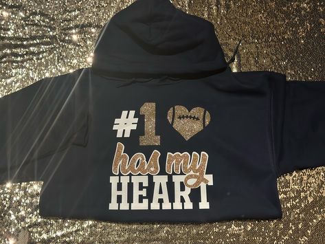 #1 has my heart 🖤🫶🏾Custom Football Hoodie! 🏈 DM or TEXT (313)318-0114 to place an order📲| #jaicreativecollection🎀 #footballseason #basketball #basketballseason #custombasketball #custombasketballhoodie #basketballgirlfriend #detroitsmallbusiness #customhoodie #customphotohoodie #proudbasketballgirlfriend #supportdetroitblackbusinesses #southfieldbusiness #smalldetroitbusinesses #proudgirlfriend Basketball Shirts For Best Friends, Football Shirts For Best Friends, Basketball Girlfriend Hoodies, Custom Basketball Shirts Girlfriend, Basketball Hoodies For Girlfriends, Girlfriend Basketball Shirts Ideas, Basketball Girlfriend Shirts Ideas, Basketball Shirts For Girlfriends, Basketball Girlfriend Shirts