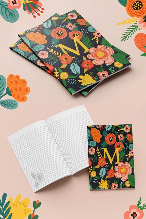 Image is of two stacked notebooks with a colorful floral design on a dark background and the letter M in the center. Underneath is an image of the open notebook with blank lined pages and a small flower design in the lower corner of the page. Monogram Notebook, The Letter M, M Monogram, Initial M, Writing Notes, New Bride, Composition Book, Floral Monogram, Colour Field