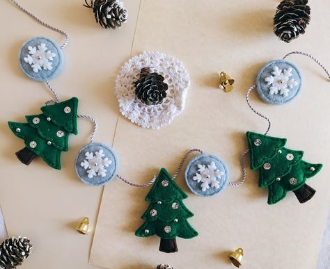 A felt handmade garland made of little pinecone trees and Snowflakes. First experiments for Winter and Christmas. Winter Felt Garland, Pinecone Trees, Winter Banner, Handmade Garland, Winter Garland, Felt Handmade, Winter And Christmas, Felt Banner, Christmas Tree Garland