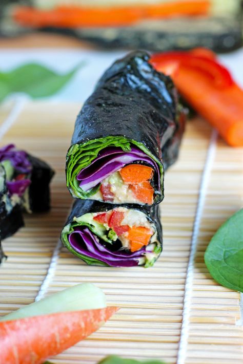 Healthy sushi rolls made with an array a raw veggies so you can eat the rainbow! NeuroticMommy.com #raw #vegan #healthy Nori Wraps, Nori Rolls, Nori Wrap, Seaweed Wrap, Healthy Mummy, Vegan Wraps, Vegan Sushi, Salmon Avocado, Sushi Recipes