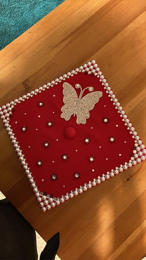 Jeweled Graduation Caps, Diamond Cap Graduation, Cap Decoration Graduation Butterfly, Pearl Grad Cap, Red Grad Cap Ideas, Red Graduation Cap Designs, Pearl Graduation Cap, Red Graduation Cap, Grad Cap Decorated