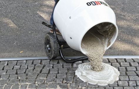 Driveway Apron: Learn How to Install One Over a Weekend - This Old House Cobblestone Driveway Apron, Garage Apron, How To Clean Grout, Driveway Apron, Clean Grout, Driveway Entrance Landscaping, Diy Driveway, Cobblestone Driveway, Apron Ideas