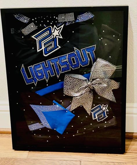 Cheer Room Ideas Bedrooms, Cheer Uniform Shadow Box Ideas, Cheer Shadow Box Ideas, Cheer Uniform Shadow Box, Cheer Room Decor, All Star Cheer Uniforms, Bow Display, Locker Decorations, Cheer Uniform