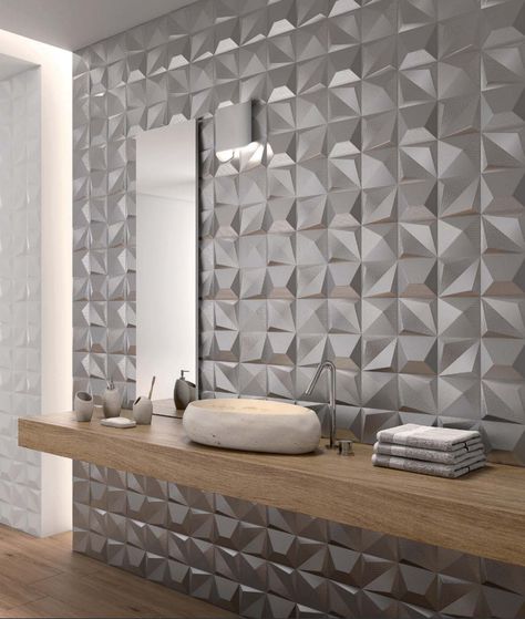 The angles and textures of these new SHAPES 3-D Tiles by Dune capture and reflect light beautifully and bring a boring wall to life! Byrd Tile Distributors in Raleigh, NC is happy to carry these tiles, perfect for your next commercial project. #ByrdTile #CommercialTiles #BathroomDesign #ContemporaryTiles 3d Tiles Bathroom, Contemporary Bathroom Lighting, Contemporary Tile, Kitchen Tiles Design, Bathroom Wall Panels, Wall Tiles Design, 3d Tiles, Decor Baie, Stylish Bathroom