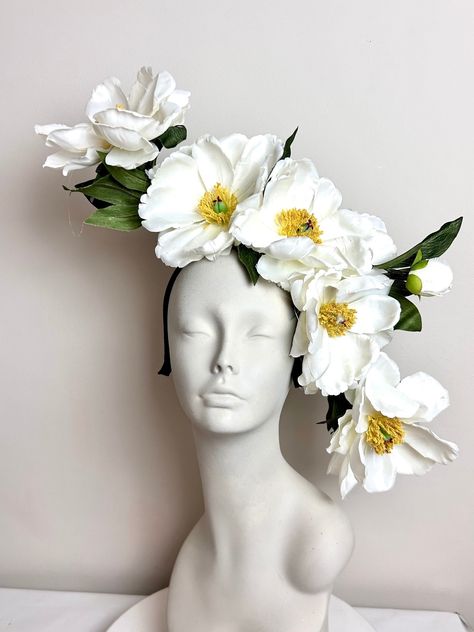 large Ivory Magnolia Fascinator -Flower Headband- Horse Race- Derby- Wedding- Racing Fashion - Polo  Hello, This off-white fascinator is made with five  off white/ivory magnolia in the front and several in the back.  The blossoms are 6"  wide and have  magnolia leaves and buds. It is attached to a satin covered skinny headband and is adjustable. It's very comfortable and will fit any size head. Has a yellow center. --------------------------------- I ship US Postal Service.  USA DOMESTIC CHOICES Kentucky Derby Fascinator Diy, Crazy Kentucky Derby Hats, Derby Hat Diy, Kentucky Derby Headband, White Floral Headpiece, Horse Racing Fashion, Headgear Fashion, Derby Headband, Floral Fascinator