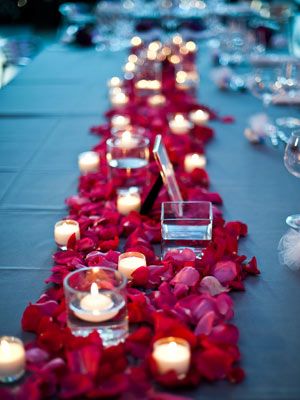 Create a table runner out of flower petals.  This would be beautiful in any color! Rose Petal Candle, Candles And Flowers, Ruby Wedding Anniversary, 40th Wedding Anniversary, Ruby Wedding, Rose Candle, Wedding Table Decorations, Valentine Wedding, Romantic Roses