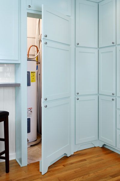 Faux cabinet doors hide a dedicated area for the water heater, formerly jammed into a closet shared with the pantry. There's even room for a new water softener as well. Hide Water Heater, Basement Decoration, Dream Basement, Basement Laundry Room, Basement Laundry, Basement Storage, Basement Makeover, Basement Ceiling, Unfinished Basement