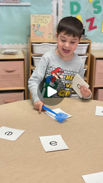 Sharyn Kish on Instagram: "Here are a few ways to use those mini fly swatters…   1. Teacher (or family member) says a word. Students “swat” the beginning sound heard in the word dictated. (Great phoneme to grapheme practice) The first one to slap it gets to grab it from the table. Play until there are no more cards.   2. Play the same way but students listen for the middle vowel sound. **You can change up the game to listen for ending sounds in the words dictated.   3. Sound Circle. Lay out letter cards on the table (or use post-it notes). Students use a whisper phone and “fun” pointer to walk around the table and “whisper” read the letter and sound for each card. (A great way to informally assess and provide immediate feedback)  #kinder #kindergarten #kindergartenactivities #firstgradetea Fun Letter Sound Activities, Letter Sound Practice Kindergarten, Beginning Sound Games Kindergarten, Practicing Letter Sounds, How To Teach Letter Recognition And Sounds, Letter Recognition Activities For Kindergarten, Ending Sound Activities For Kindergarten, Phonic Sound Activity For Kids, Vowel Activity For Kindergarten