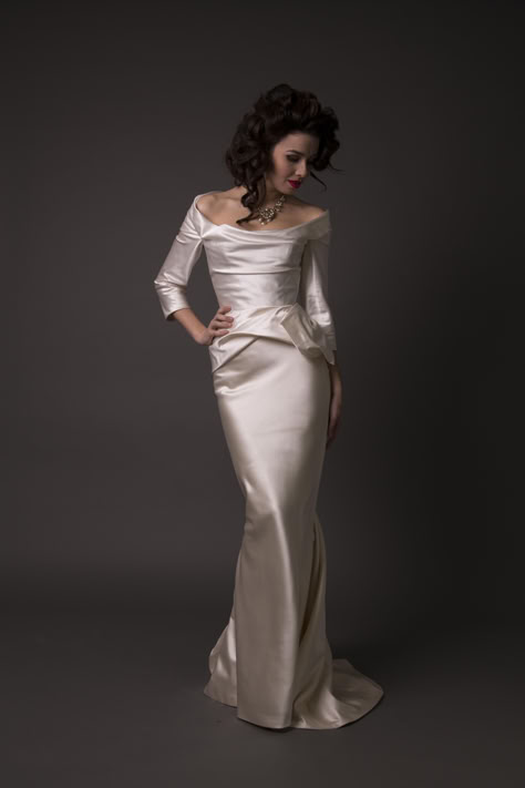 Woman wears an ivory silk duchess satin wedding dress by couture wedding dress designer Angelina Colarusso, with slim floor length skirt with a train, long sleeves and off the shoulder neckline for an older bride. Corseted bodice. Lydia Wedding Dress, Angelina Colarusso, Wedding Dresses For Older Brides, Dresses For Older Brides, Wedding Dresses London, Elegant Wedding Dresses, Couture Wedding Dresses, Bespoke Wedding Dress, Wedding Dress Boutiques