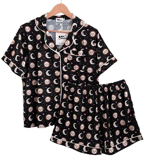 A fun and comfy pair of pajamas featuring my own celestial print - you won't find this print anywhere else! This shorts and button up top set features a front pocket and contrast piping. It comes in sizes Small - 4X so if you're unsure which size to go with please order up as many people think they run small! They're made of a cotton/poly blend and are super duper soft, stretchy and comfy. Please note that these are stretchy pj's so there is wiggle room with the measurements - there is also elastic in the waist and they will stretch a bit more than the measurements listed if you need it. SIZING Small:        38" chest/23" length/28" waist unstretched Medium:   40" chest/24" length/29" waist unstretched Large:        42" chest/24" length/31" waist unstretched XL:             44" chest/25" l Emo Pjs, Button Down Pajamas, Shorts And Top Set, Celestial Sun And Moon, Pajamas Shorts, Celestial Print, Celestial Sun, Pyjama Sets, Button Down Shirt Dress