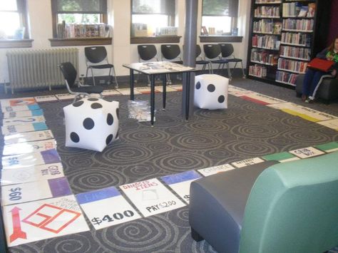 This is the Life-Size Monopoly Game I made. Each piece is 1/2 a piece of poster board with the corners being a piece of posterboard cut to be square. ALl decorated with markers/sharpies and laminated without names on the spaces so I can change the space names. The money is normal size so my teens can carry it as they play as their own pieces. Life Size Monopoly Game Diy, Large Board Game Decorations, Life Size Game Board, Life Size Board Games Diy, Monopoly Life Size, Giant Monopoly Pieces Diy, Life Size Monopoly, Giant Monopoly Game, Giant Game Board