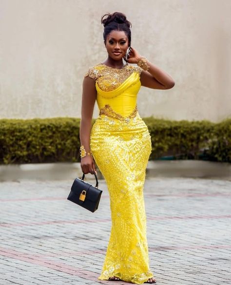 Best and Stunning 2023 Asoebi Gown Styles for Lace. - Ladeey Latest Asoebi Styles Lace 2023, Trending Aso Ebi Lace Styles 2023, Yellow Asoebi Lace Styles, Yellow Lace Asoebi Styles, Asoebi Gown Styles, Asoebi Lace Styles Classy, Nigerian Traditional Dresses, Lace Asoebi Styles, Lace Styles For Wedding