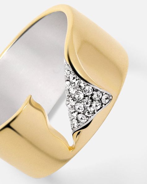 The ring has a dimensional shape, contrasting colors and is unexpectedly ripped and finished with crystals that will brighten even the dreariest of days. Fine craftsmanship meets the “rip and tear” style and the spirit of breaking the rules. Here, the ripped edge delivers a sense of brave elegance to the anything-but-classic band ring. Let it shine solo or style with other essentials, from AM to PM.              Band Width: 10mm Band Thickness: 1.5mm  Material: Crystals, 14k Gold Vermeil Rip And Tear, Affordable Rings, Breaking The Rules, Couples Wedding Bands, Dimensional Shapes, Jewelry Designing, Wide Band Ring, Let It Shine, Contemporary Ring