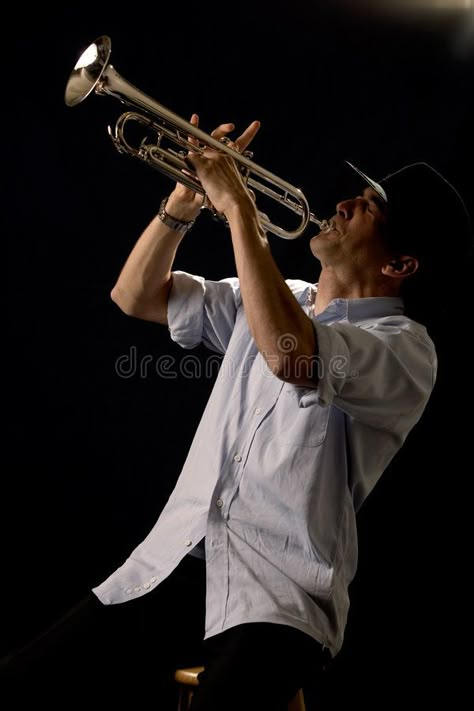 Playing the trumpet. Handsome young man playing a trumpet wearing a black hat on , #ad, #Handsome, #young, #Playing, #trumpet, #man #ad Senior Picture Ideas For Guys, Playing Trumpet, Play Trumpet, Gesture Drawing Poses, Musician Portraits, Musician Photography, Live Music Photography, Music Jokes, Trumpet Players