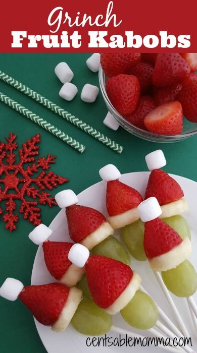 Help make the holidays a little bit healthier with these Grinch Fruit Kabobs.  They are perfect to have ready-made for a party, or you can set out the ingredients and let your kids have fun making them.  They are so cute and based off the book, How the Grinch Stole Christmas. Grape Strawberry Santa, Grape Santa Hats, Santa Hat Strawberry, Strawberry Banana Grape Santa Hats, Grinch Grapes And Strawberries, Fruit Santas On A Stick, Easy To Make Christmas Snacks, Christmas Fruit Cups For Kids, Santa Strawberry Hats