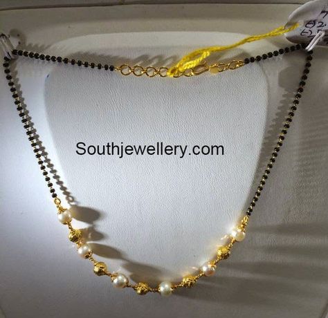 22 carat gold light weight simple black beads mangalsutra chain strung with gold balls and south sea pearls from Premraj Jewellers. Weight: 5 grams For inquiries contact on Whatsapp: +91 97 00 009000 or Email: dharmesh25@yahoo.com Related PostsBlack Beads Mangalsutra DesignsShort Black Beads ChainShort Light Weight Mangalsutra Chains5 Grams Black Beads Mangalsutra ChainsSimple Black Beads Simple Black Beads, Black Beads Mangalsutra, Black Beads Mangalsutra Design, Gold Jewelry Simple Necklace, Gold Mangalsutra Designs, Gold Necklace Indian Bridal Jewelry, Beaded Necklace Designs, Gold Mangalsutra, Mangalsutra Designs