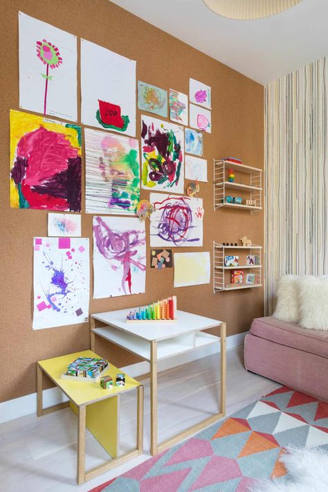 This Tiny, Colorful Playroom Has a Huge Statement Wall | Cubby Cork Board Playroom, Cork Art Wall, Cork Wall Ideas, Apartment Playroom, Playroom Desk, Floating Wall Desk, Wall Cubbies, Cork Board Wall, Colorful Playroom