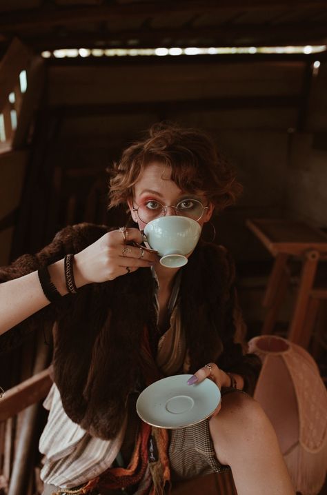 Macie Cheetham photographed by Tessa Cheetham #editorial #editorialphotography #photography #photoshoots #portrait #portraitphotography #character #characterdesign #characterinspiration #people #makeup #costume #costumedesign #colour #story #storytelling #narrative #narrativephotography #suitcase #nature #tree #outdoors #afternoon #backyard #tea #teacups Sipping Tea Pose, Poses In Tea Garden, People Drinking Tea Photography, Drinking Tea Photography, Having Tea Photography, British Person Drinking Tea, Editorial Illustration Magazine, Tea Cup Drawing, Ad Photography