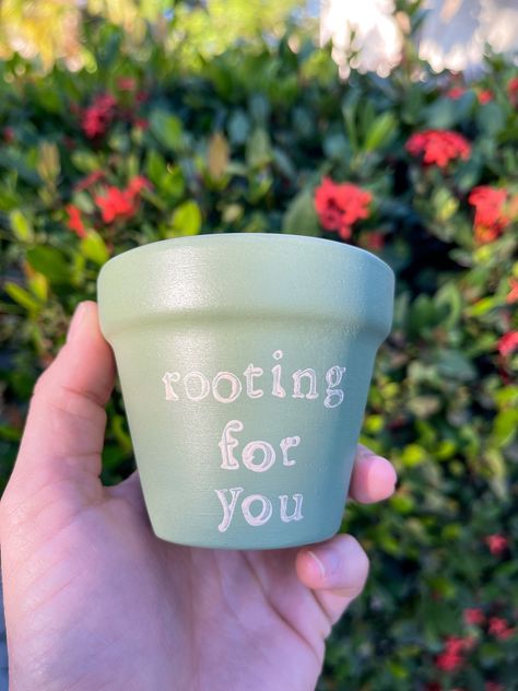 A little motivation can go a long way! Whether it's a friend, you, or your plants that need some encouragement - this pot will do the trick.  Dimensions: 3"h x 3"w For a long life, this pot has been soaked, sanded, and sealed with Plaid Clay Pot Sealer. For decoration, it was painted with matte acrylic paint and finished with Mod Podge Acrylic Sealer.  This pot is made from a terracotta material and has a drainage hole. While it has been sanded, some ridges may remain. Since terracotta pots are Small Terracotta Pot Painting Ideas, Painted Planter Ideas, Garden Pot Painting, Cute Plant Pots Painting, Mini Pot Painting Ideas, Painted Pots Diy Creative, Plants Pots Ideas, Small Pot Painting Ideas, Painted Flower Pots Ideas