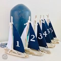 Wedding Table Centerpieces Beach Theme, Sailboat Table Numbers, Nautical Wedding Signs, Beach Table Numbers, Nautical Centerpiece Ideas, Boat Wedding Decorations, Nautical Table Centerpieces, Sailboat Centerpiece, Sailing Wedding