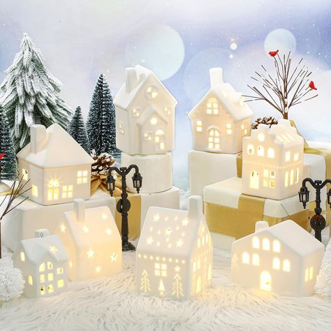 PRICES MAY VARY. 26 Pieces Christmas Villages Sets: the Christmas village accessories include 8 ceramic houses, 16 trees of different sizes and styles (2 bare branch trees with cardinal, 2 white round pine trees, 2 white long pine trees and 10 green pine trees), and 2 lamp posts, providing an extensive range for your festive decorations Quality Material: these Christmas village pieces are designed with the delicate craftsmanship; The houses are made of durable ceramic that ensures longevity and